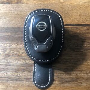 Nissan Black and Silver sunglasses holder